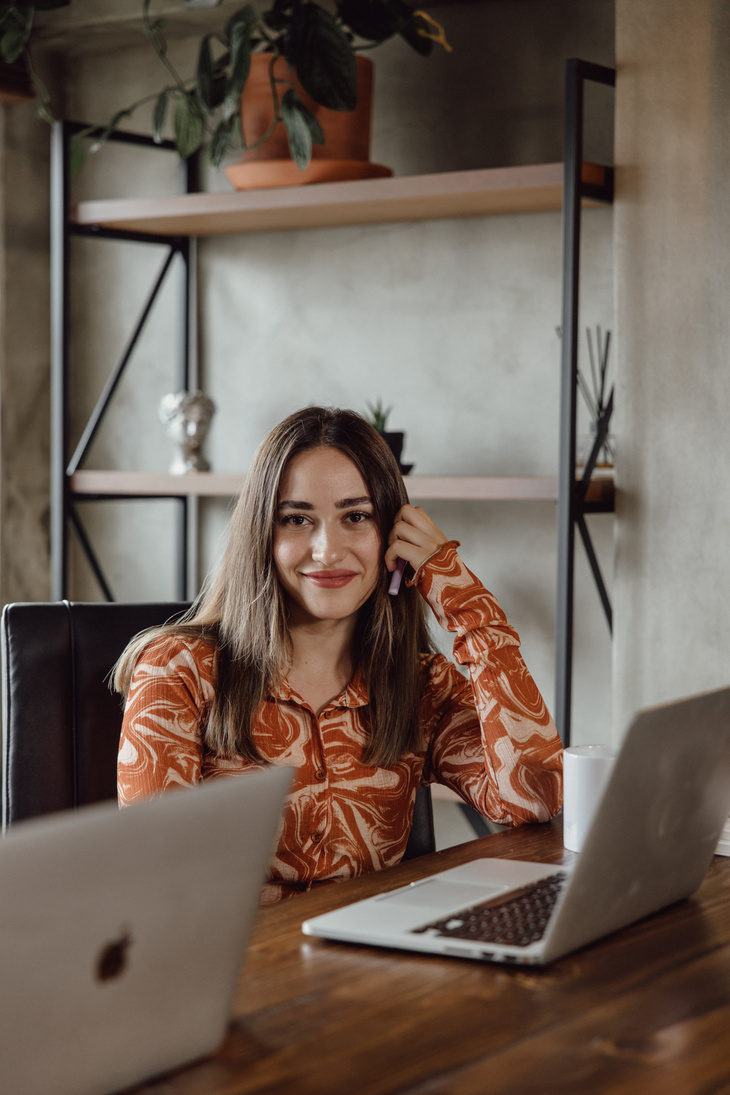 Woman with Laptop Working in the Office